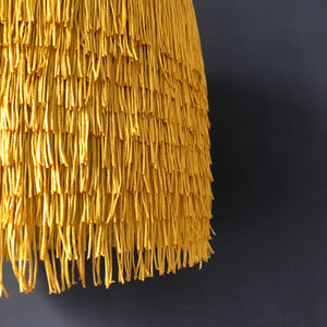 Gold tassel lampshade with Cole & Son liner