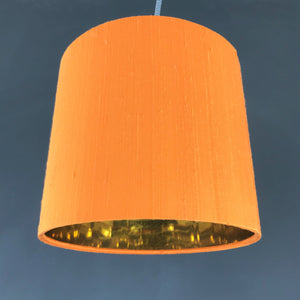Tangerine silk lampshade with mirror gold liner
