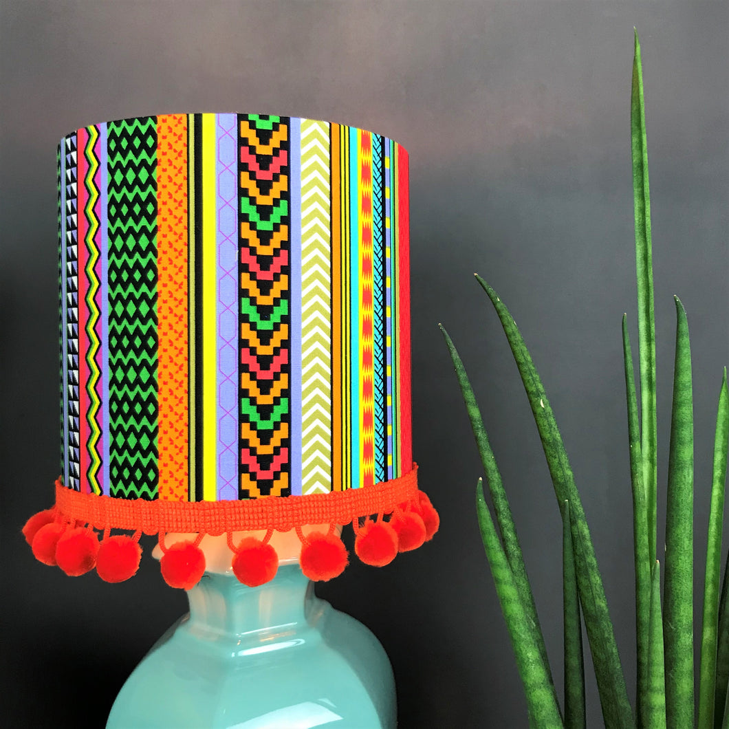 Multi-stripe fabric with mirror copper liner and optional orange pompom lampshade